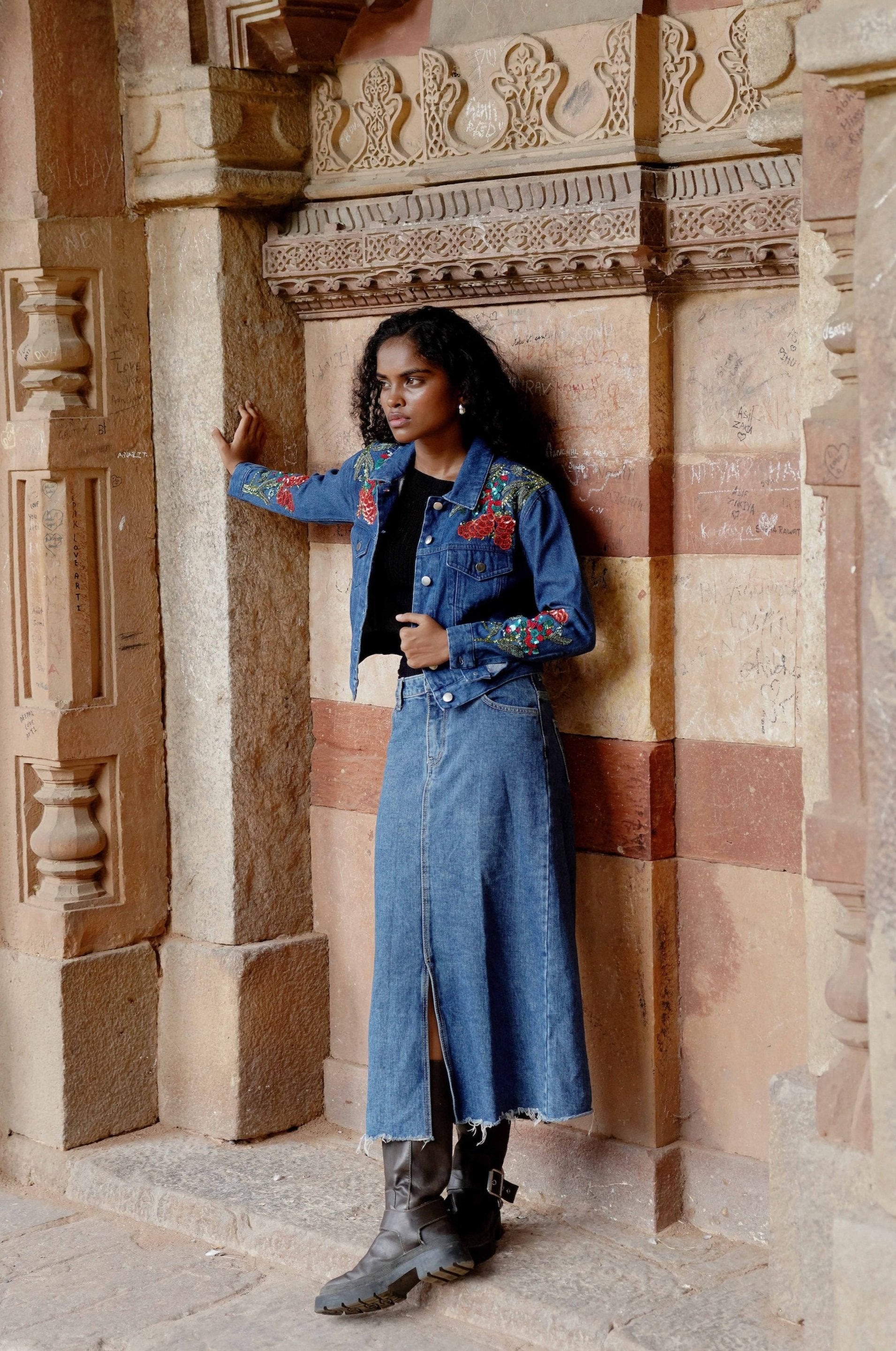 Side picture of blue cropped denim jacket