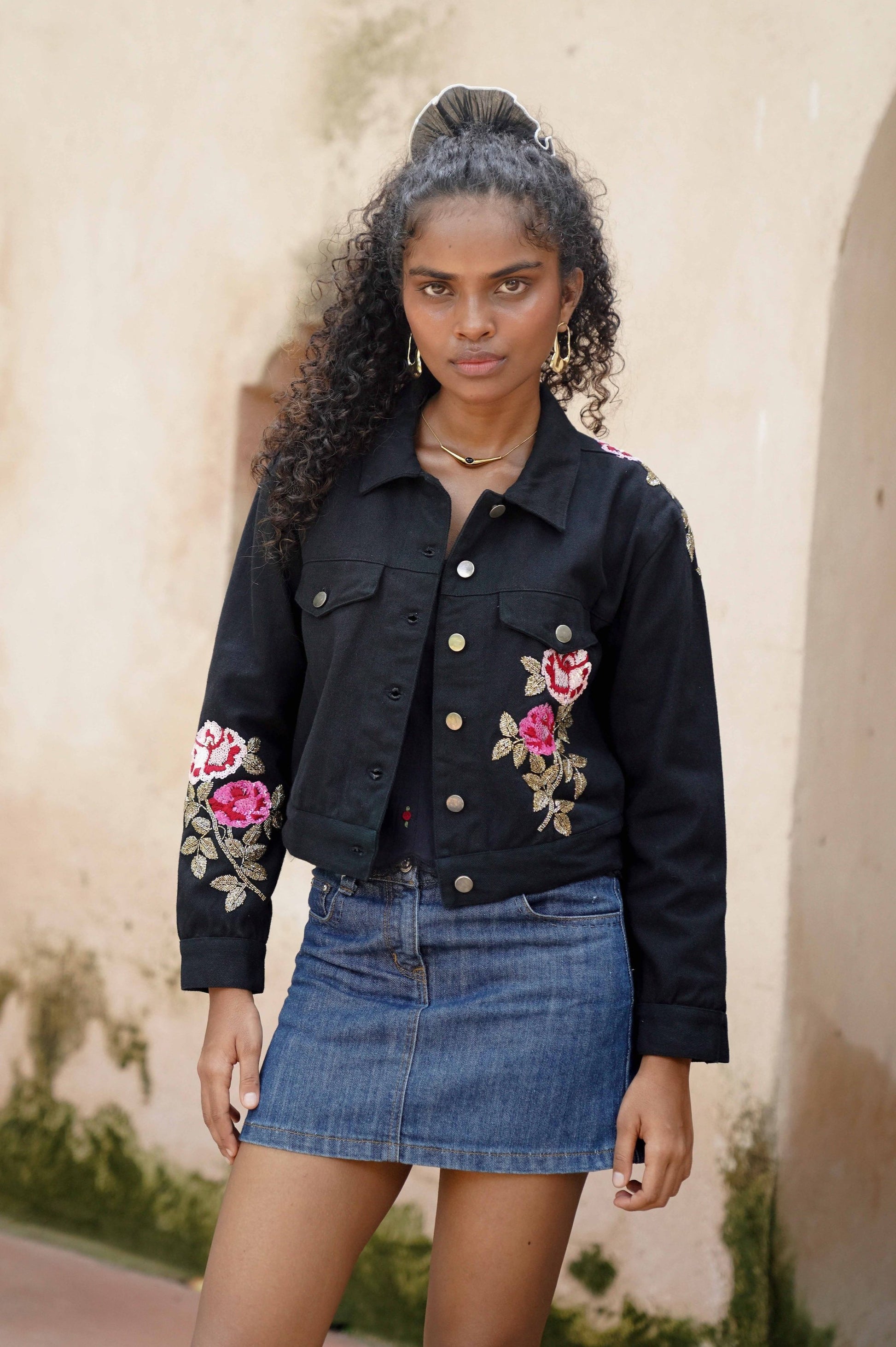 Front picture of black embroidered denim jacket