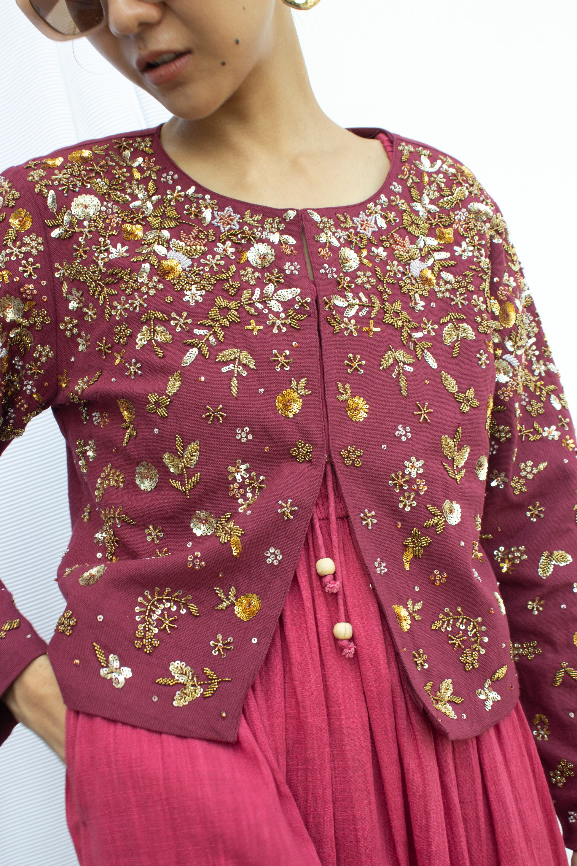 Front detail picture of of burgundy embroidered cropped jacket