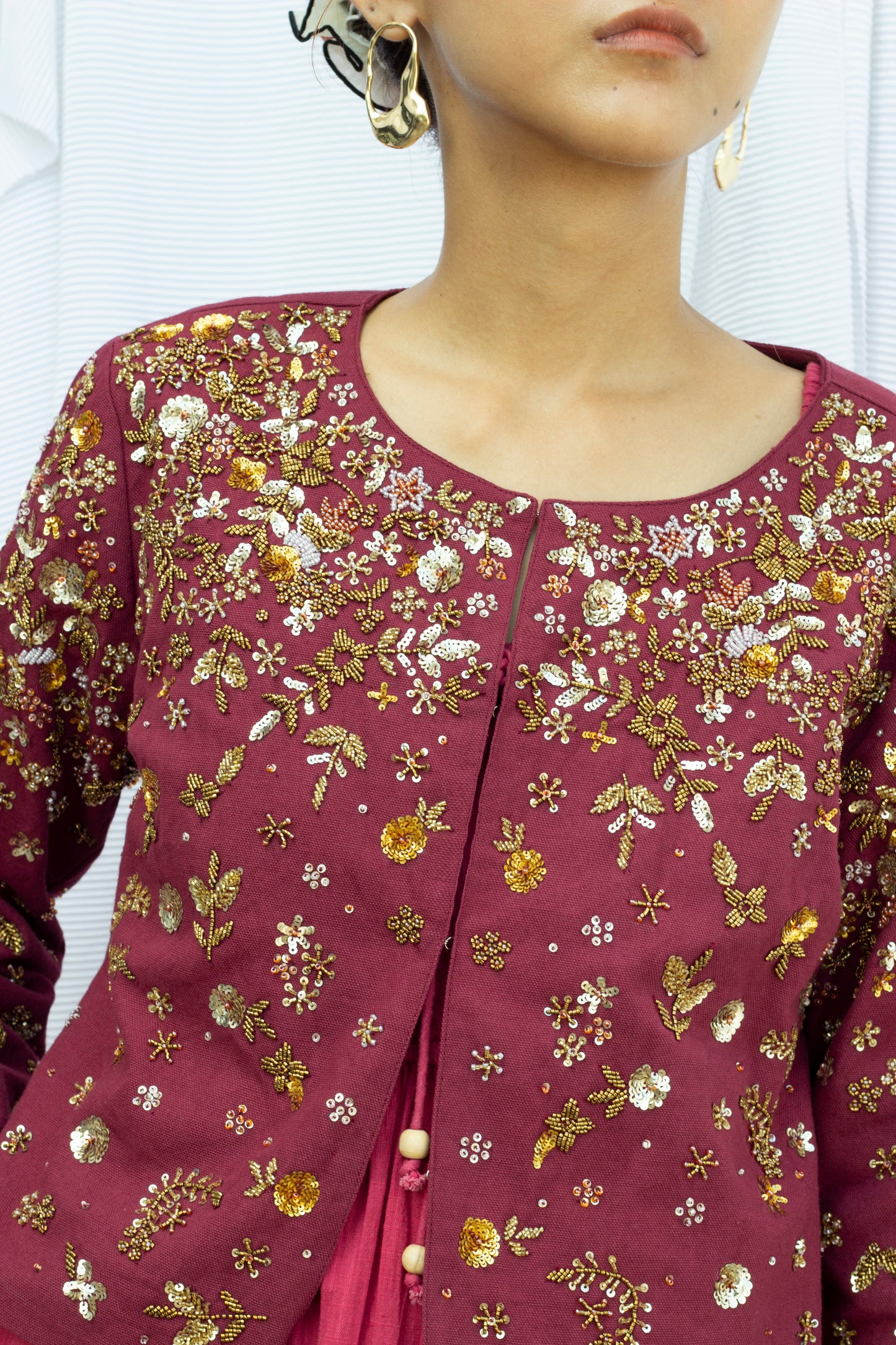 Closeup picture of burgundy embroidered cropped jacket