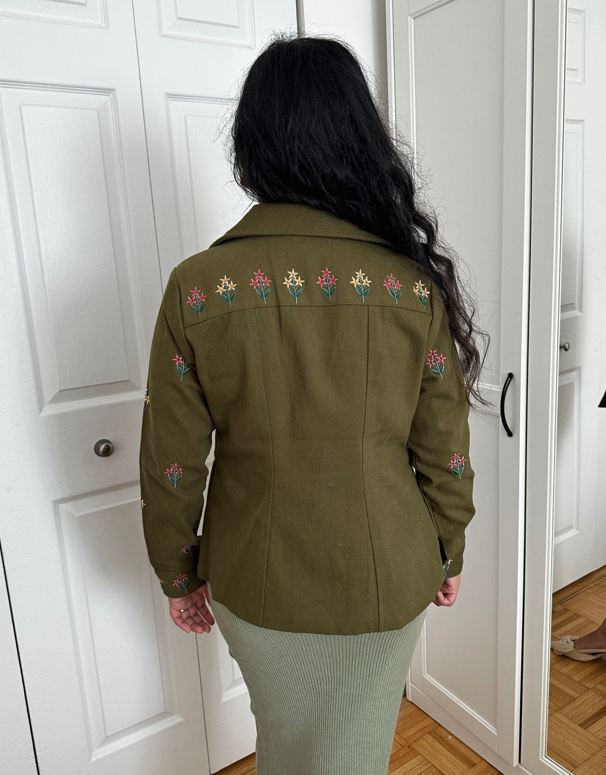 Back photo of olive green embroidered jacket