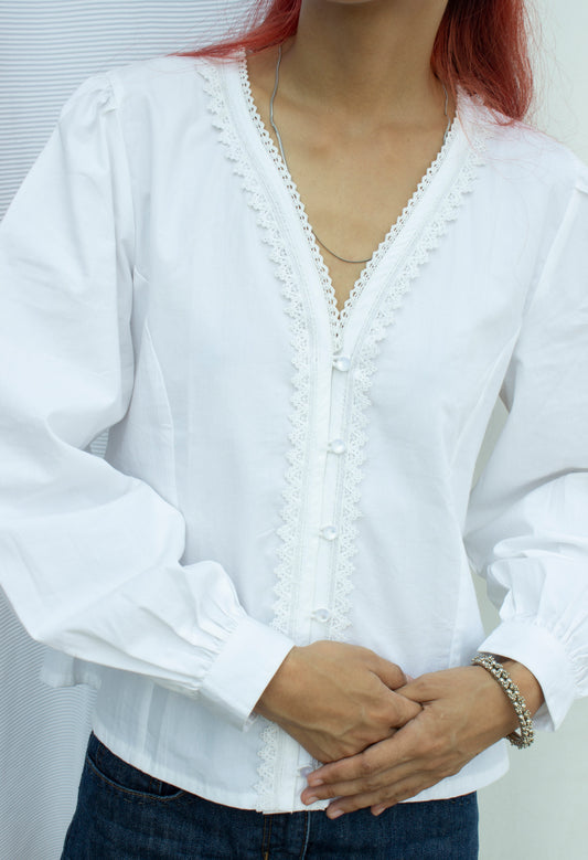 Front picture of white puff sleeve blouse with lace trim detail