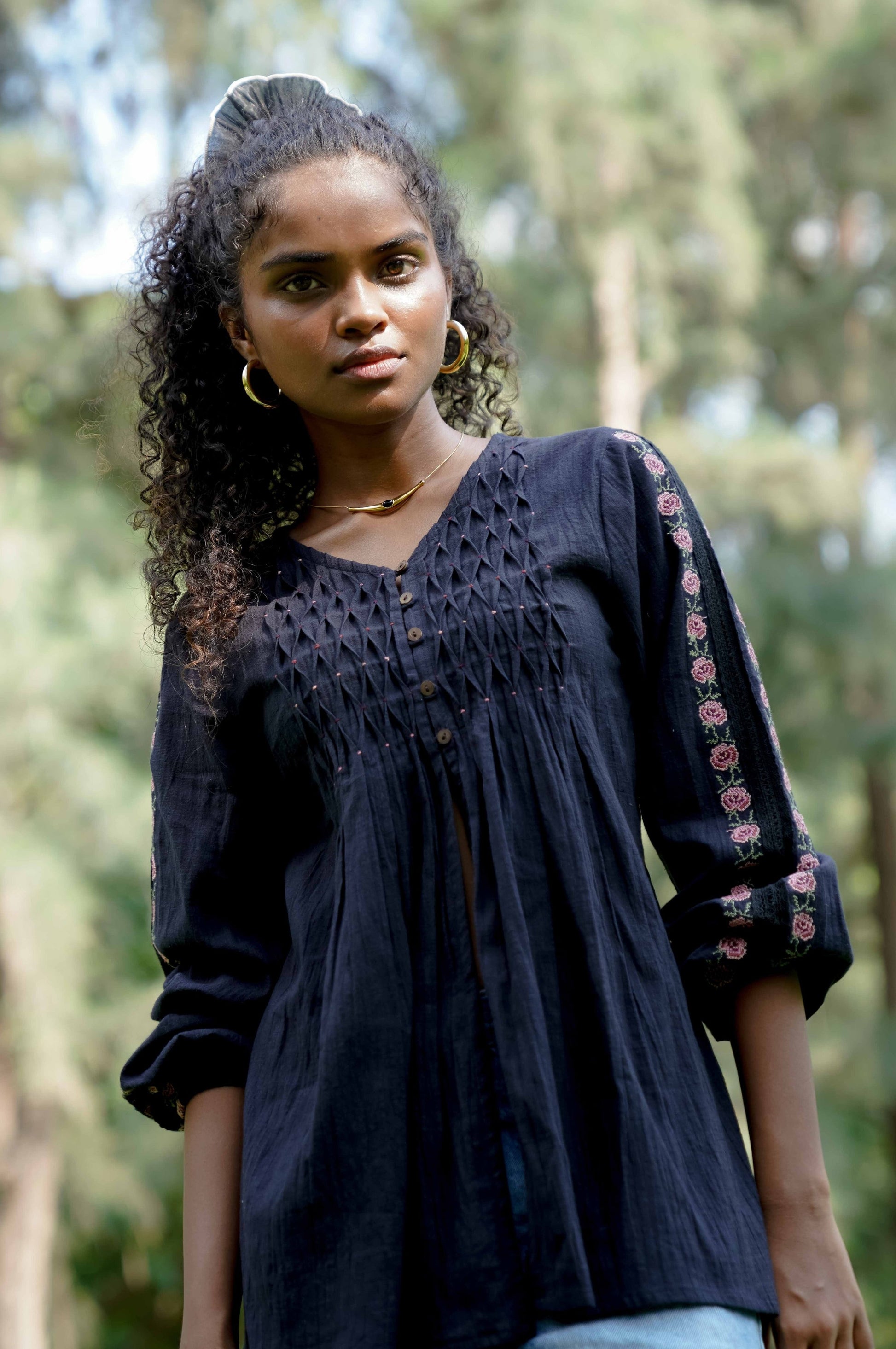 Close up picture of black embroidered top